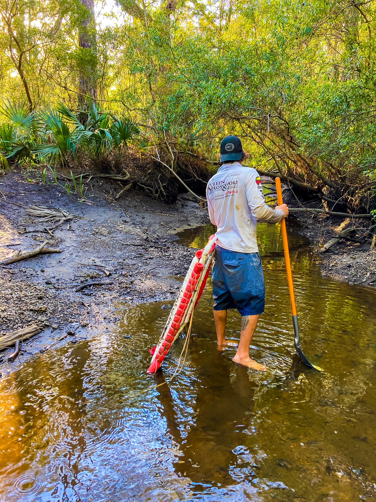 Fossil hunting with sifter and shovel